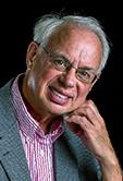 man with glasses in stripped shirt